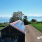 Toiture Willy, ferblanterie avec tuiles et panneau solaire avec vue sur le lac et le balcon