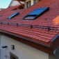 Gouttières en cuivre avec tuile en terre cuite et velux