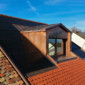 Lucarne en cuivre avec photovoltaïque et tuiles rénové