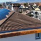 Toiture rénovée, détails en cuivre et performance photovoltaïque à Gland par Willy Toiture SA