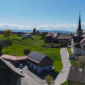 Vue sur les nouvelles toitures de deux maisons à Mannens et sur le Jura Suisse