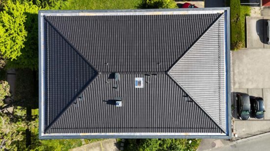 Réfection de la toiture d'un immeuble à Gland, Chavannes