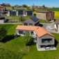 Vue aérienne sur la réalisation des toitures à Mannens, Fribourg